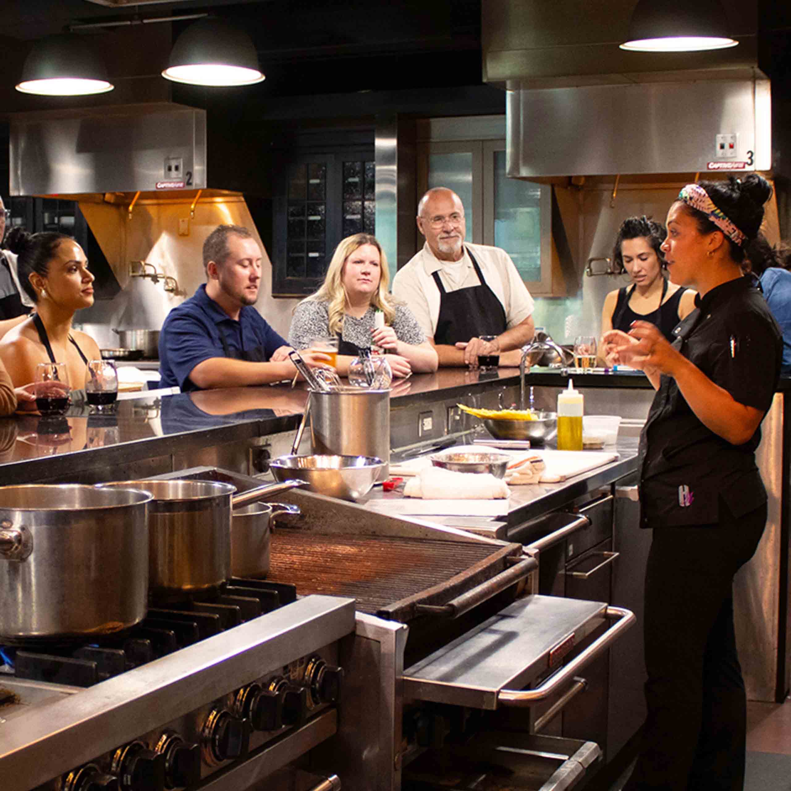 Chef Daniela teaching cooking class at Mirepoix above Holiday Market Royal Oak